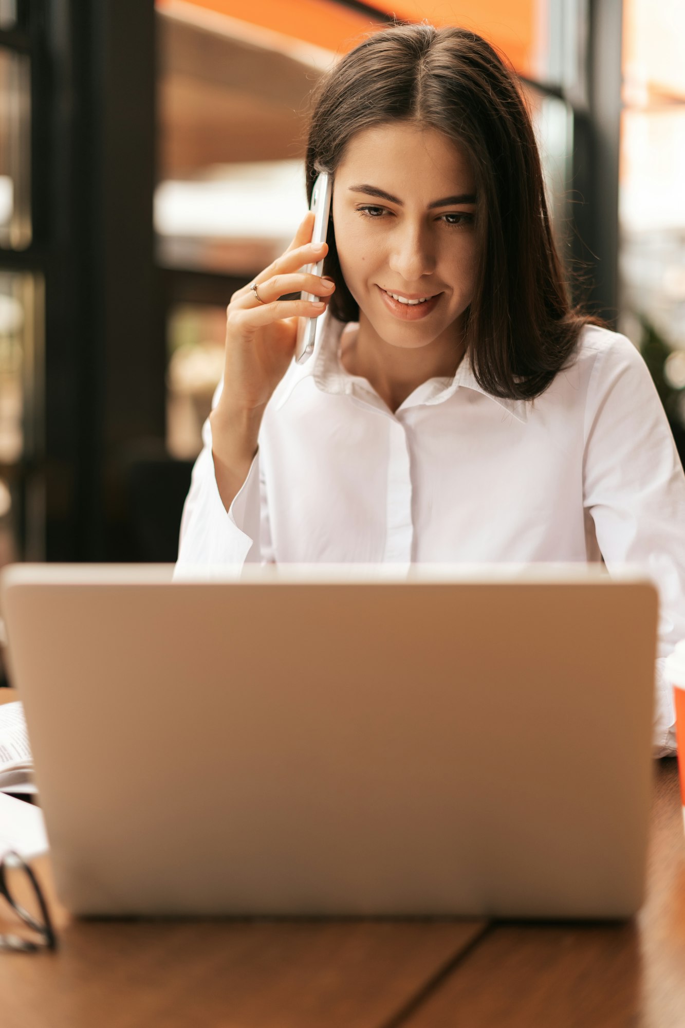 Millennial businesswoman talking on phone