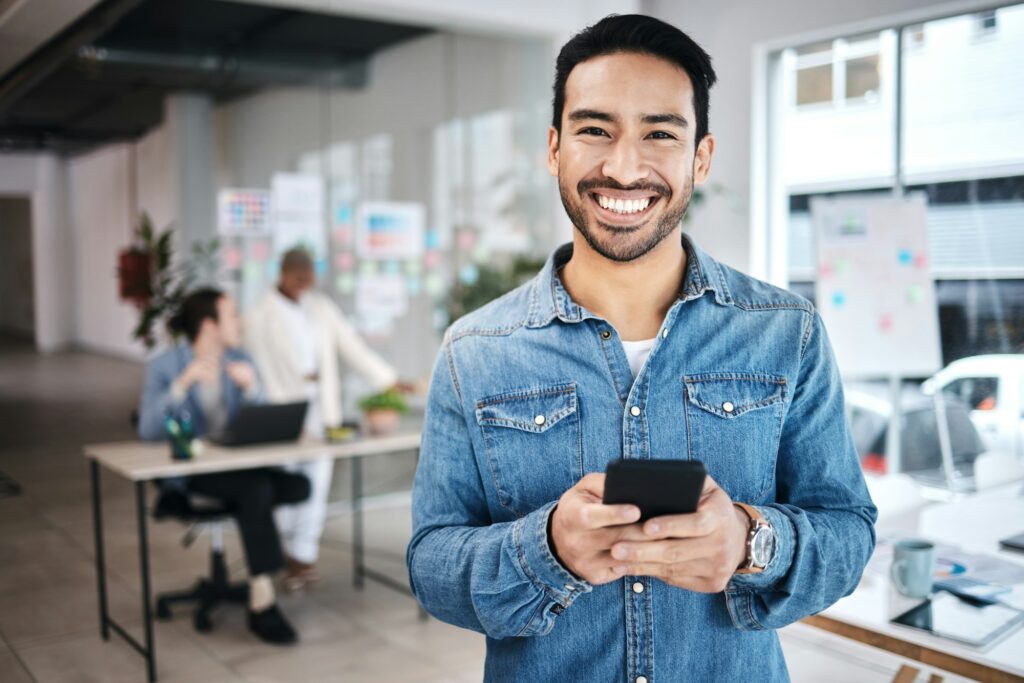 Portrait, man in business and smartphone, typing and communication at startup with company contact